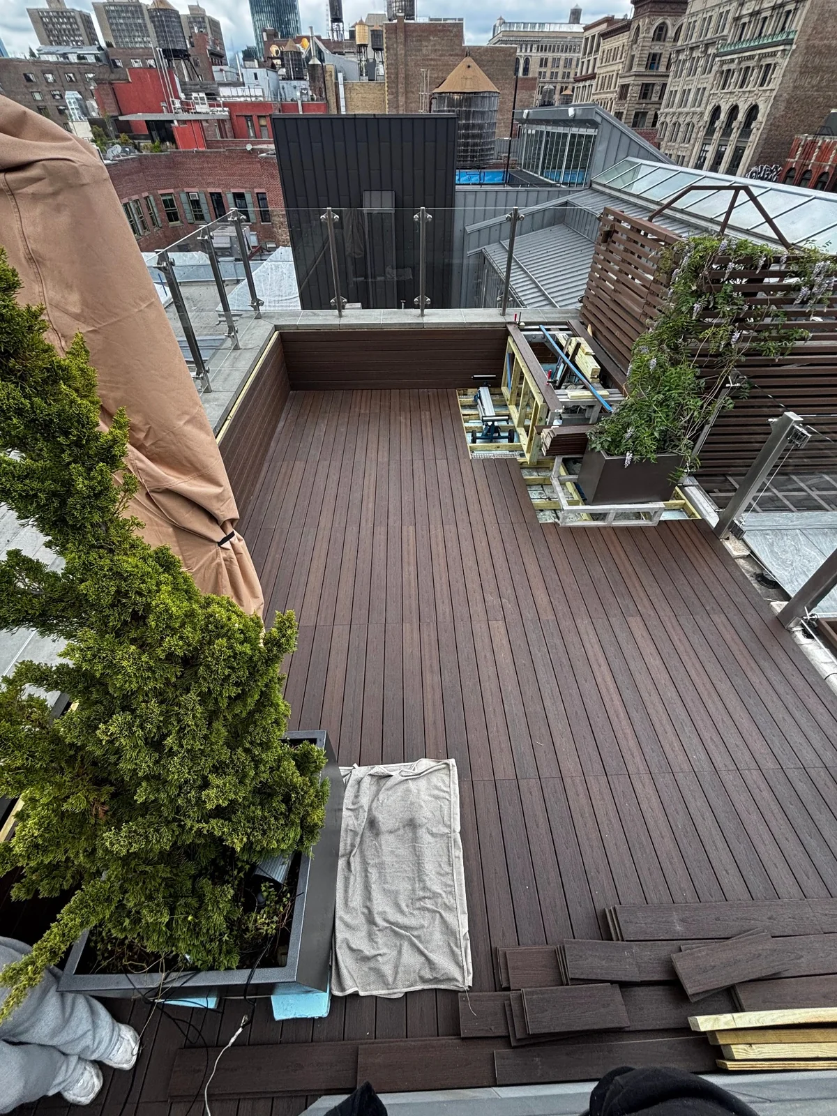 SoHo penthouse deck installation with open sections showing the supporting framework