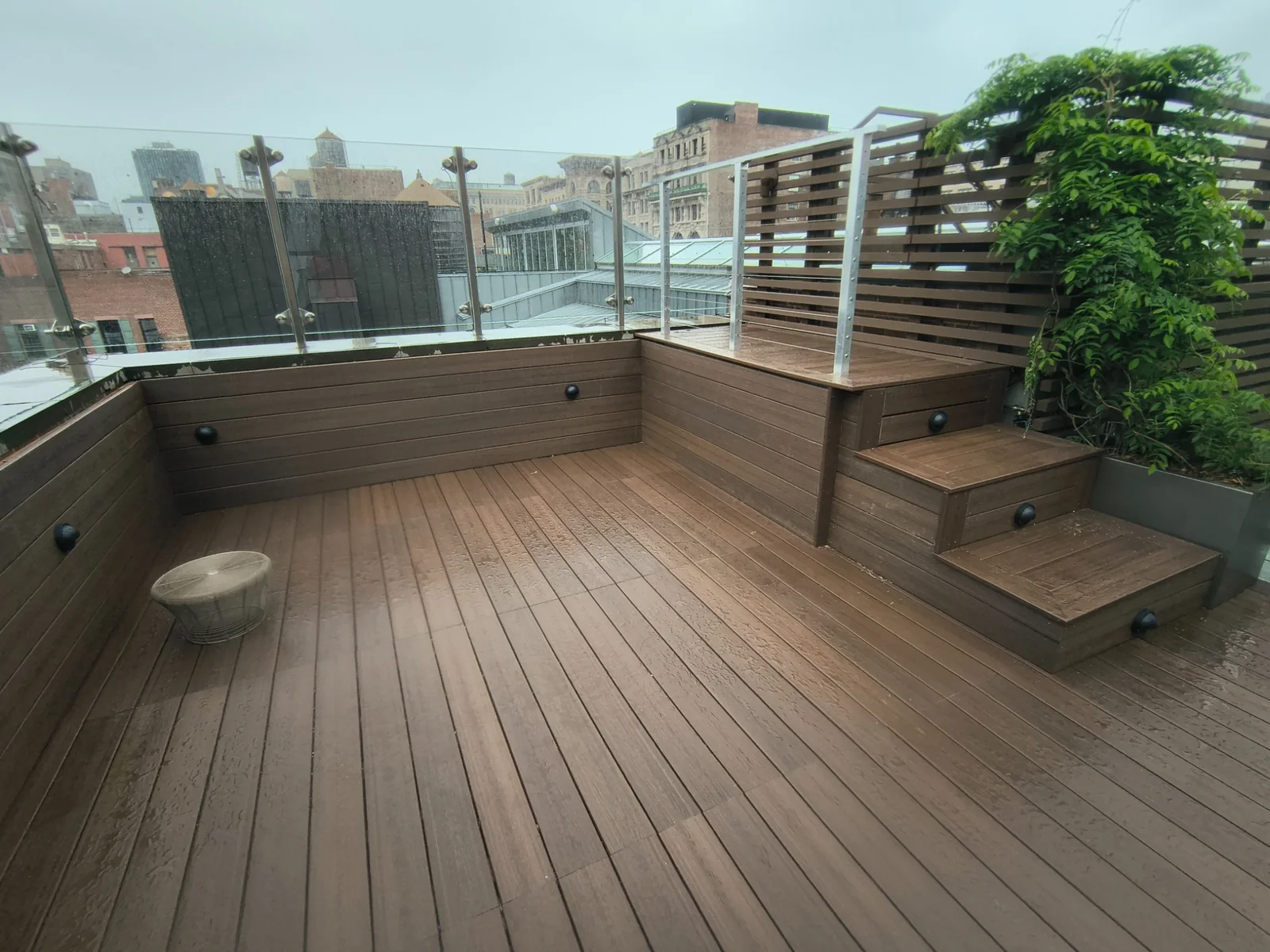 Completed two-level Fiberon rooftop deck with clad steps and integrated lights in SoHo