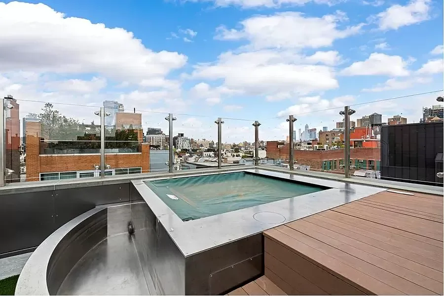 Original custom stainless-steel hot tub on a SoHo penthouse rooftop
