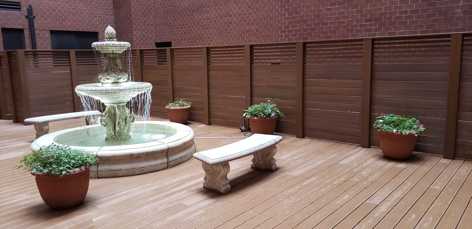 Courtyard fountain patio by City Decks New York.