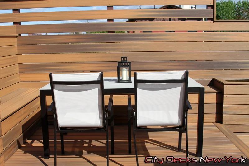 Slatted privacy screen bar seating by City Decks New York.